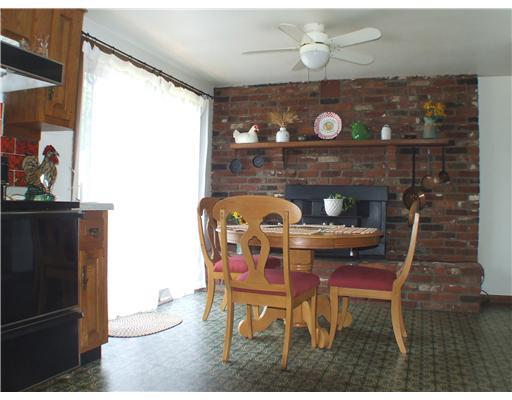 223 Wray Large Road Jefferson Hills, PA 15025 - Photo 13 of 15 Kitchen. The brick wall features custom keystones, a mantel and a wood burner that can be used for cooking.