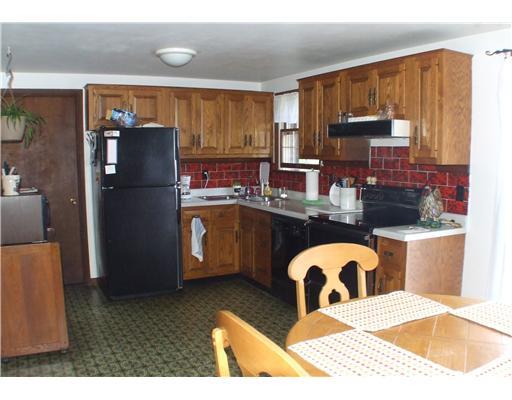 223 Wray Large Road Jefferson Hills, PA 15025 - Photo 3 of 15 Kitchen. The fully equipped, country kitchen boasts a wood burner, plenty of oak cabinets and sliding glass doors that leads to a beautiful view. The laundry room is off the kitchen.