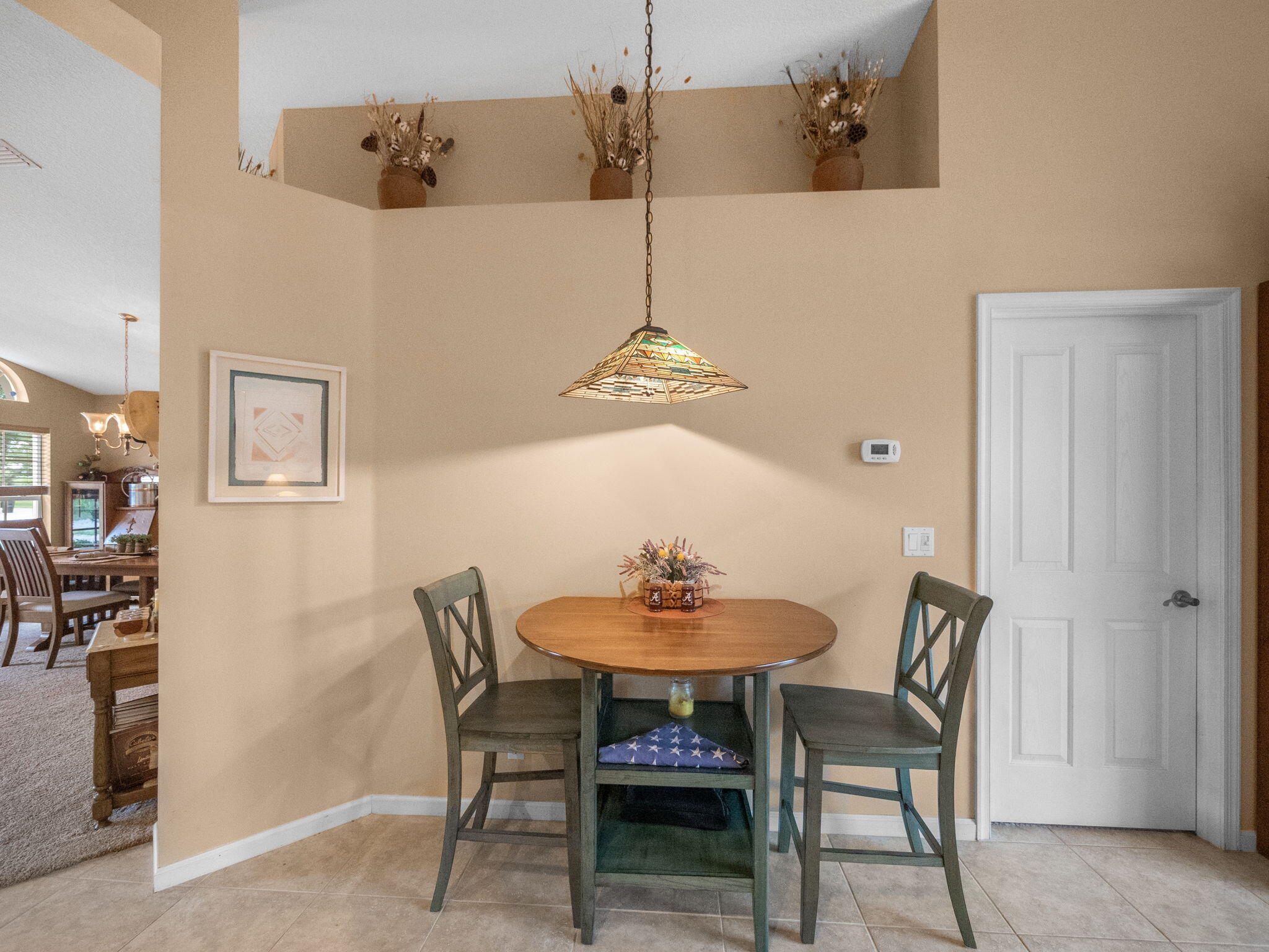 8121 Southwest Yachtsmans Drive Stuart, FL 34997 - Photo 12 of 28 a dining room with furniture and window