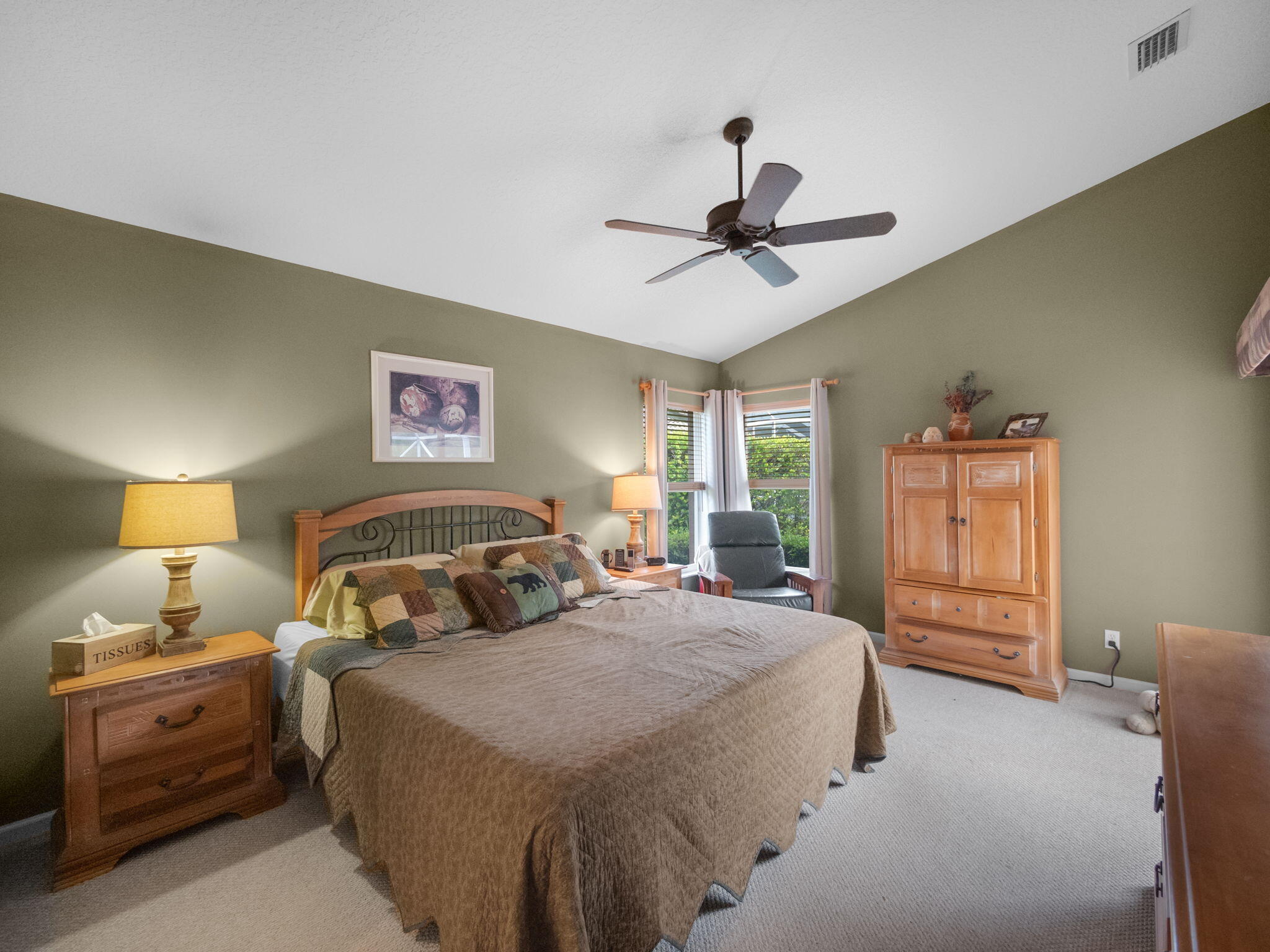 8121 Southwest Yachtsmans Drive Stuart, FL 34997 - Photo 15 of 28 a bedroom with a bed and wooden floor