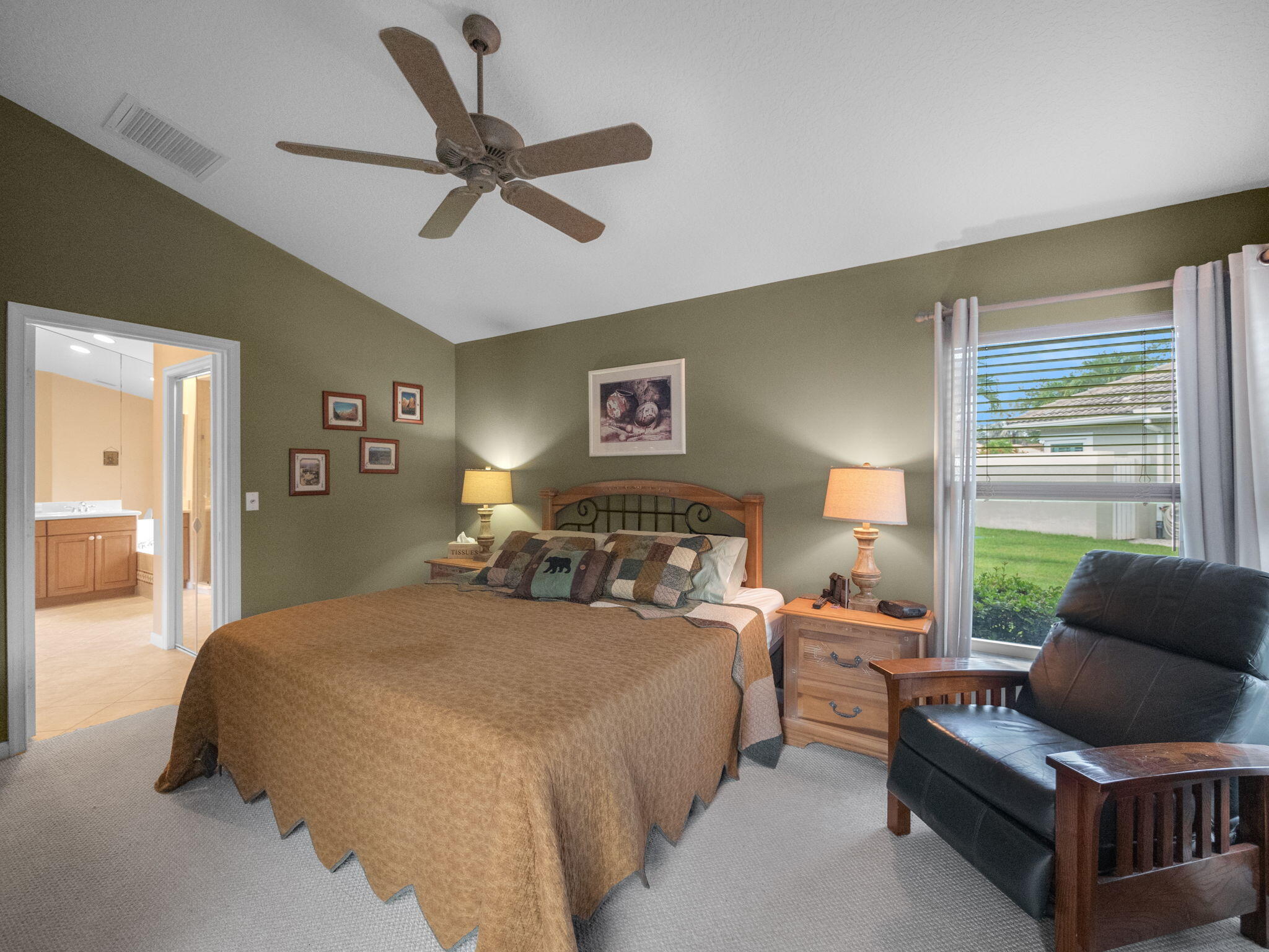 8121 Southwest Yachtsmans Drive Stuart, FL 34997 - Photo 16 of 28 a bedroom with a bed and glass window