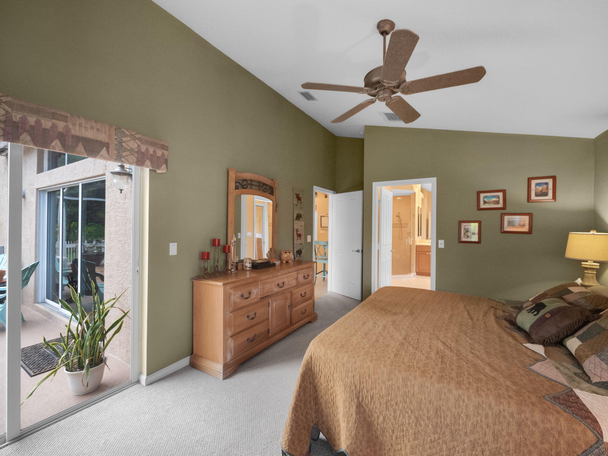 8121 Southwest Yachtsmans Drive Stuart, FL 34997 - Photo 17 of 28 a bedroom with a bed and large windows