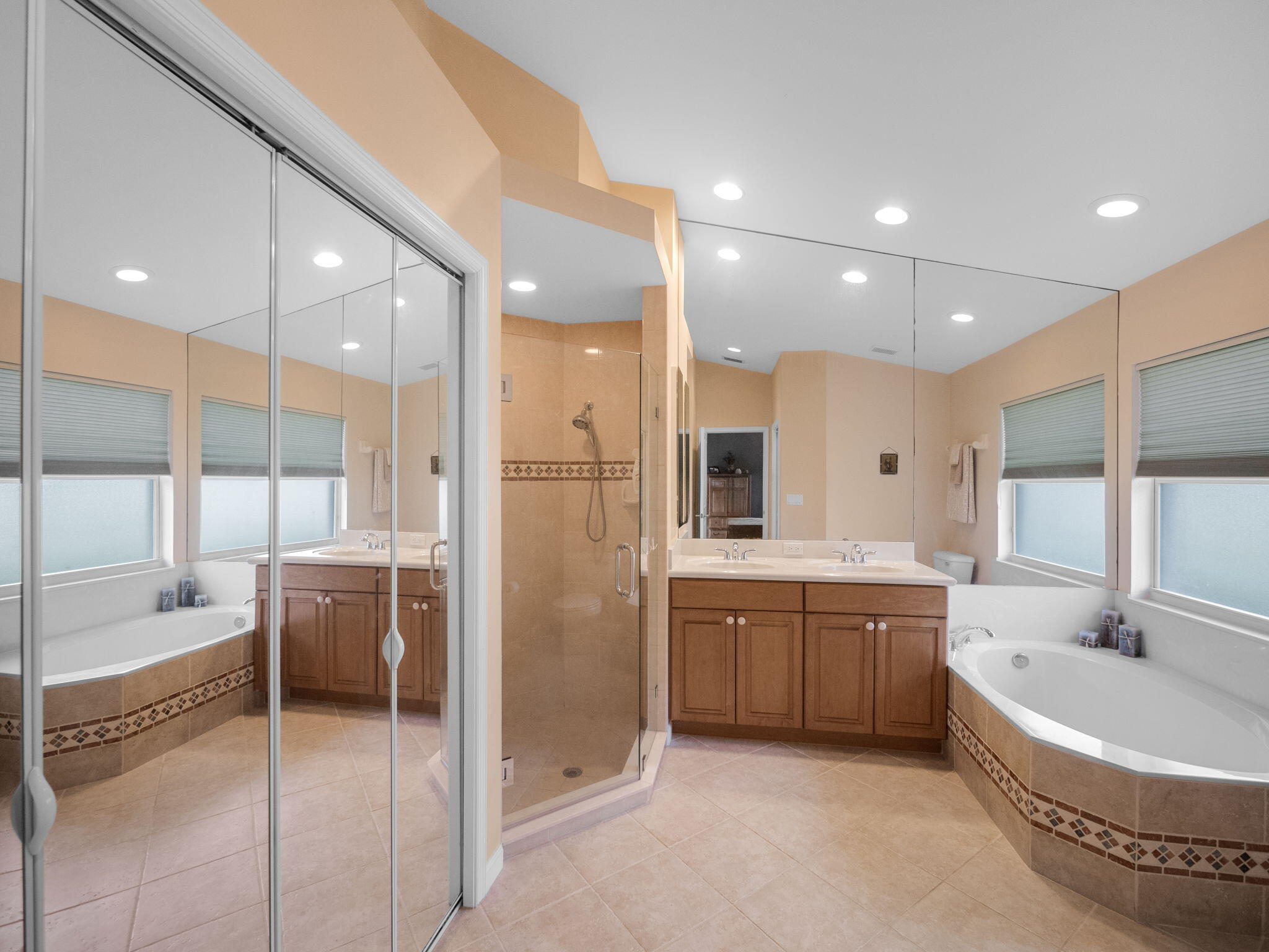 8121 Southwest Yachtsmans Drive Stuart, FL 34997 - Photo 18 of 28 a bathroom with a large tub and double vanity