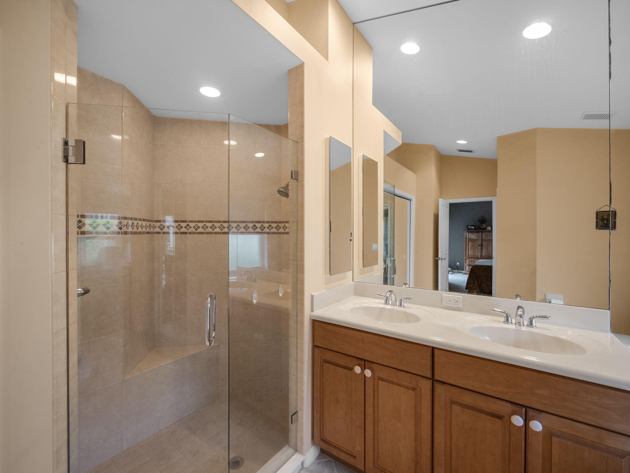8121 Southwest Yachtsmans Drive Stuart, FL 34997 - Photo 19 of 28 a bathroom with a double vanity sink mirror and shower
