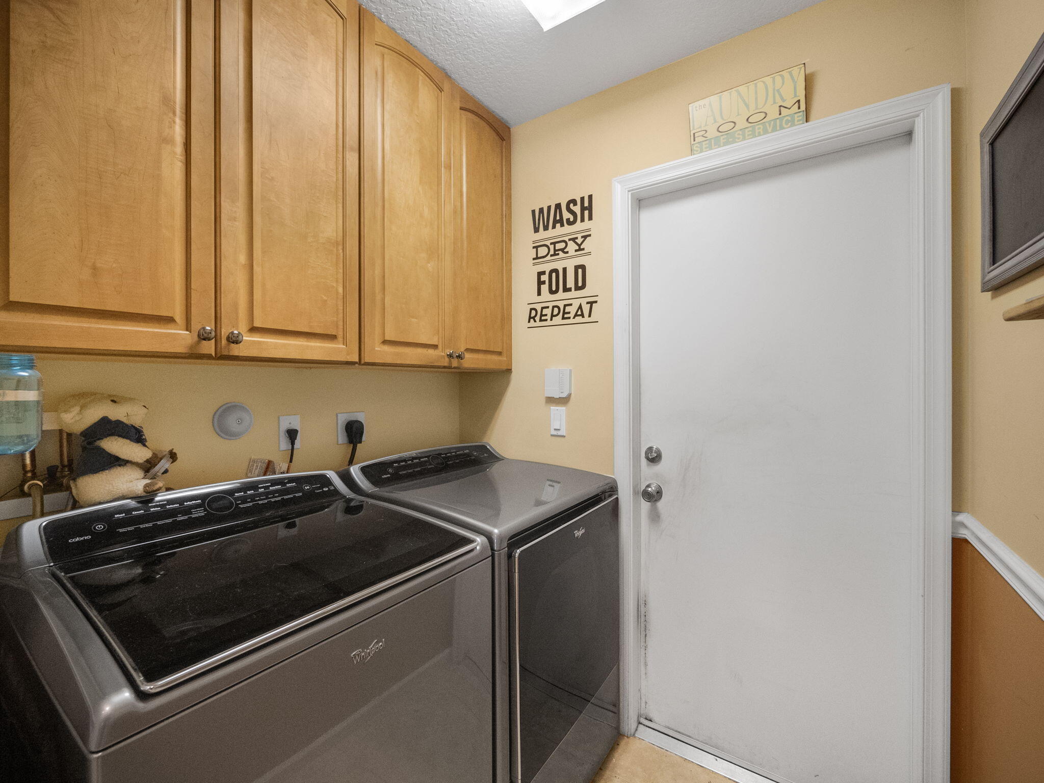 8121 Southwest Yachtsmans Drive Stuart, FL 34997 - Photo 23 of 28 a utility room with dryer and washer