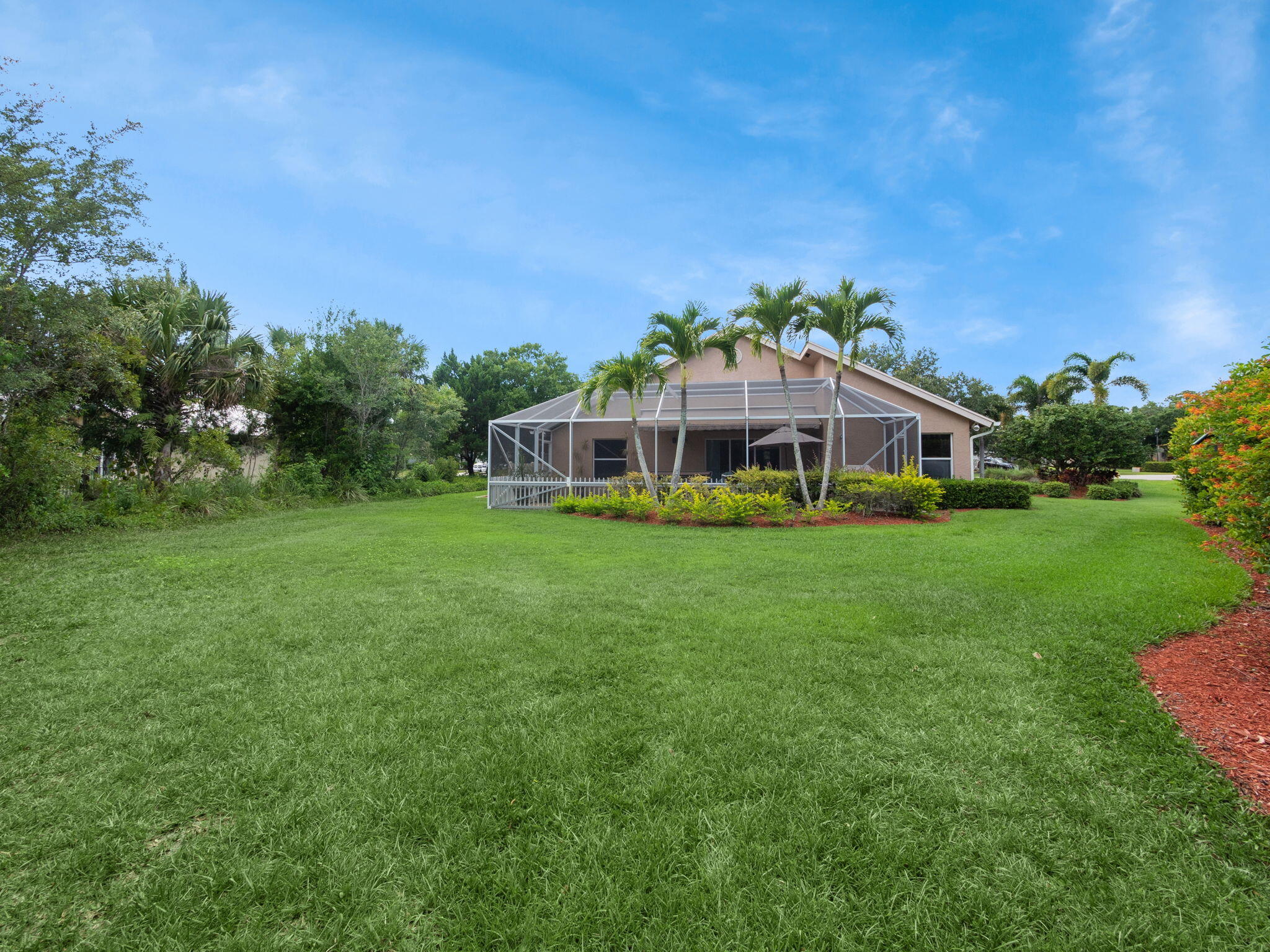 8121 Southwest Yachtsmans Drive Stuart, FL 34997 - Photo 24 of 28 a view of a house with a big yard