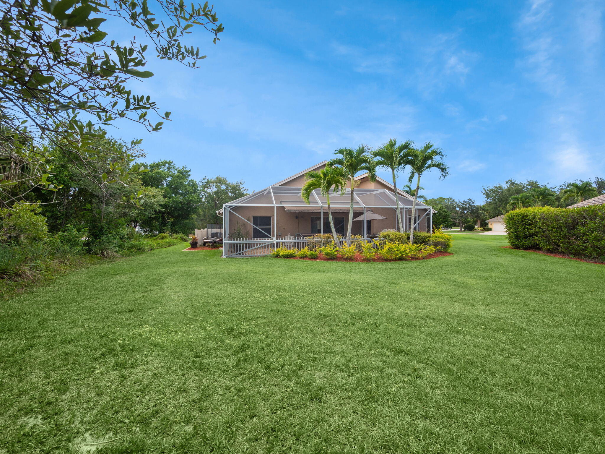8121 Southwest Yachtsmans Drive Stuart, FL 34997 - Photo 25 of 28 a view of a house with a big yard