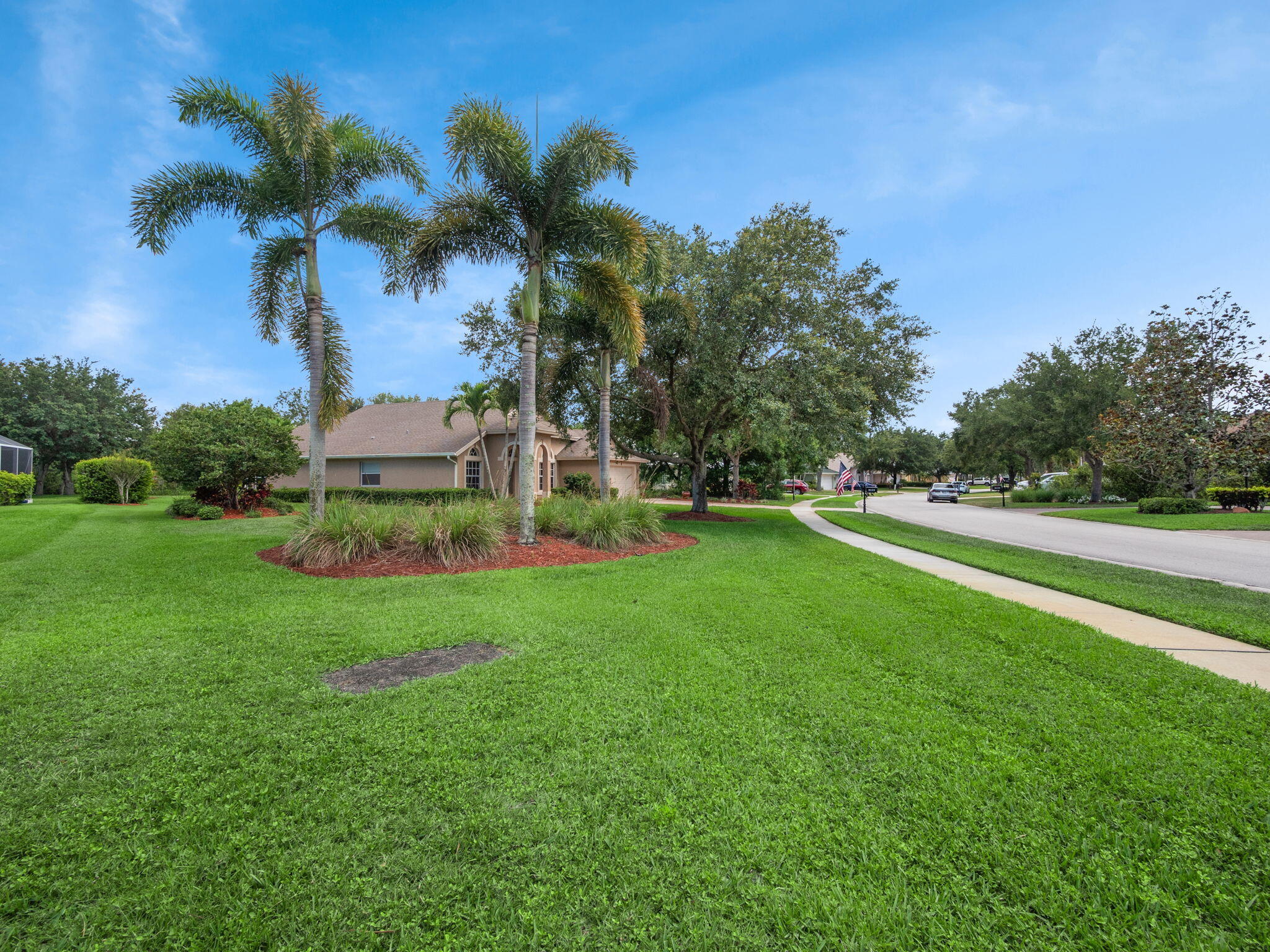 8121 Southwest Yachtsmans Drive Stuart, FL 34997 - Photo 3 of 28 a view of a garden with a palm tree