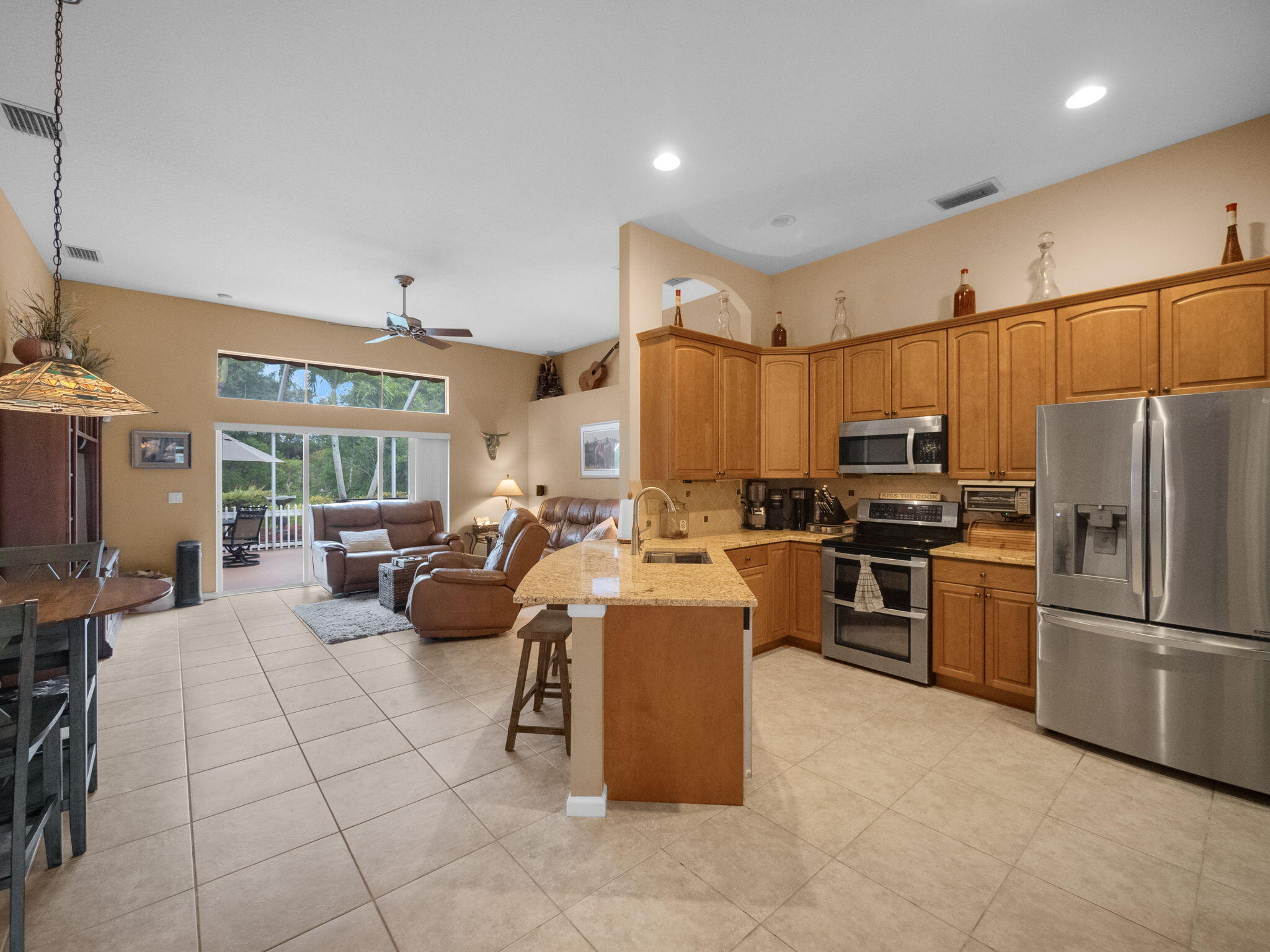 8121 Southwest Yachtsmans Drive Stuart, FL 34997 - Photo 10 of 28 a large kitchen with stainless steel appliances lots of counter top space
