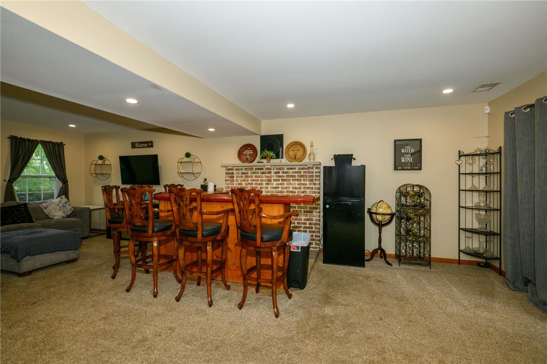 3722 Apple Road Orefield, PA 18069 - Photo 3 of 17 A fully finished basement entertaining area highlights cozy carpeting and a built-in wet bar.