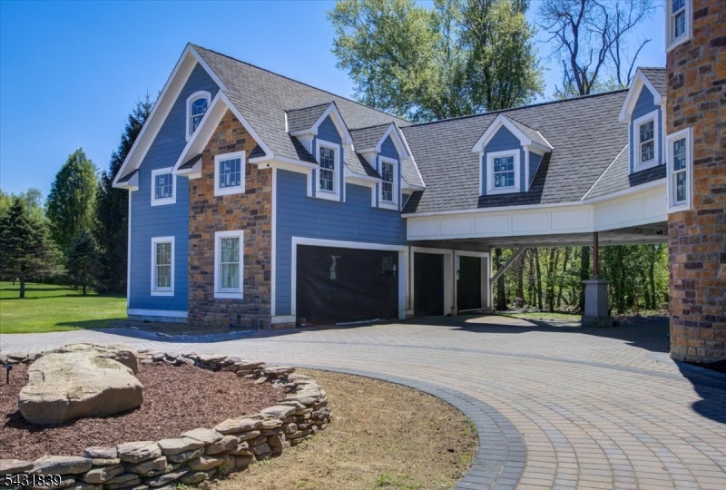 15 Spring Hunter Court Andover, NJ 07821 - Photo 11 of 49 a front view of a house with a yard