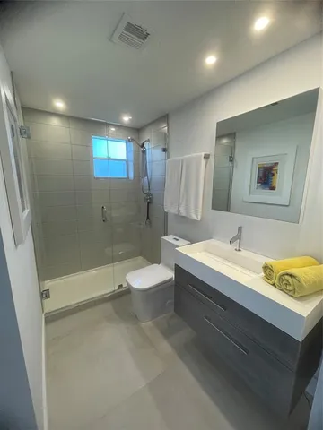 a bathroom with a sink a toilet and a bathtub