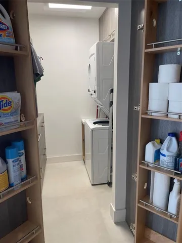 a spacious bathroom with a double vanity sink and mirror