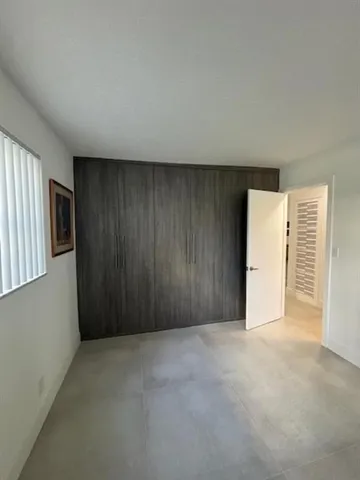 a view of a living room and a large window