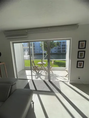 a room with furniture and pool table