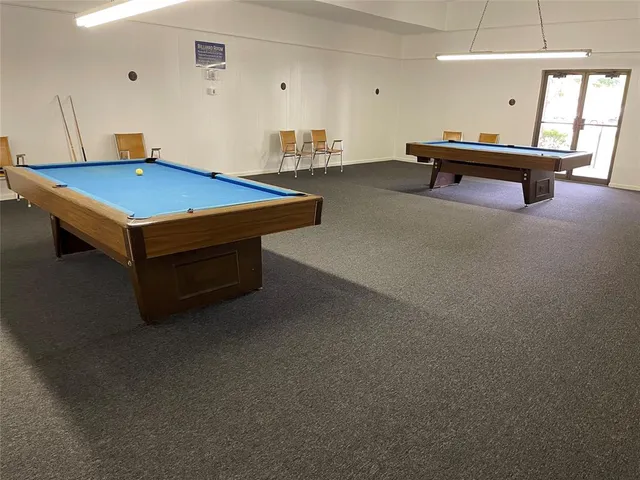 a room with gym equipment and windows