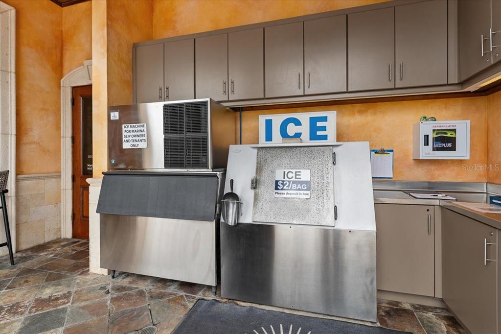 102 Riviera Dunes Way, Unit S39 Palmetto, FL 34221 - Photo 23 of 24 a view of a refrigerator in kitchen and an empty room
