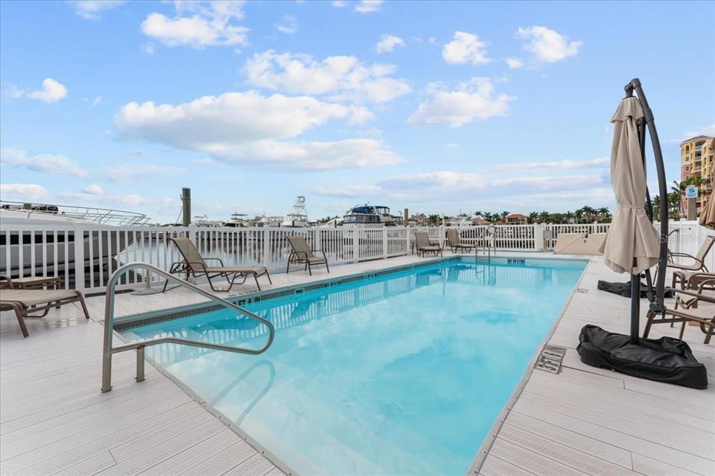 102 Riviera Dunes Way, Unit S39 Palmetto, FL 34221 - Photo 7 of 24 a view of a swimming pool with seating area and furniture