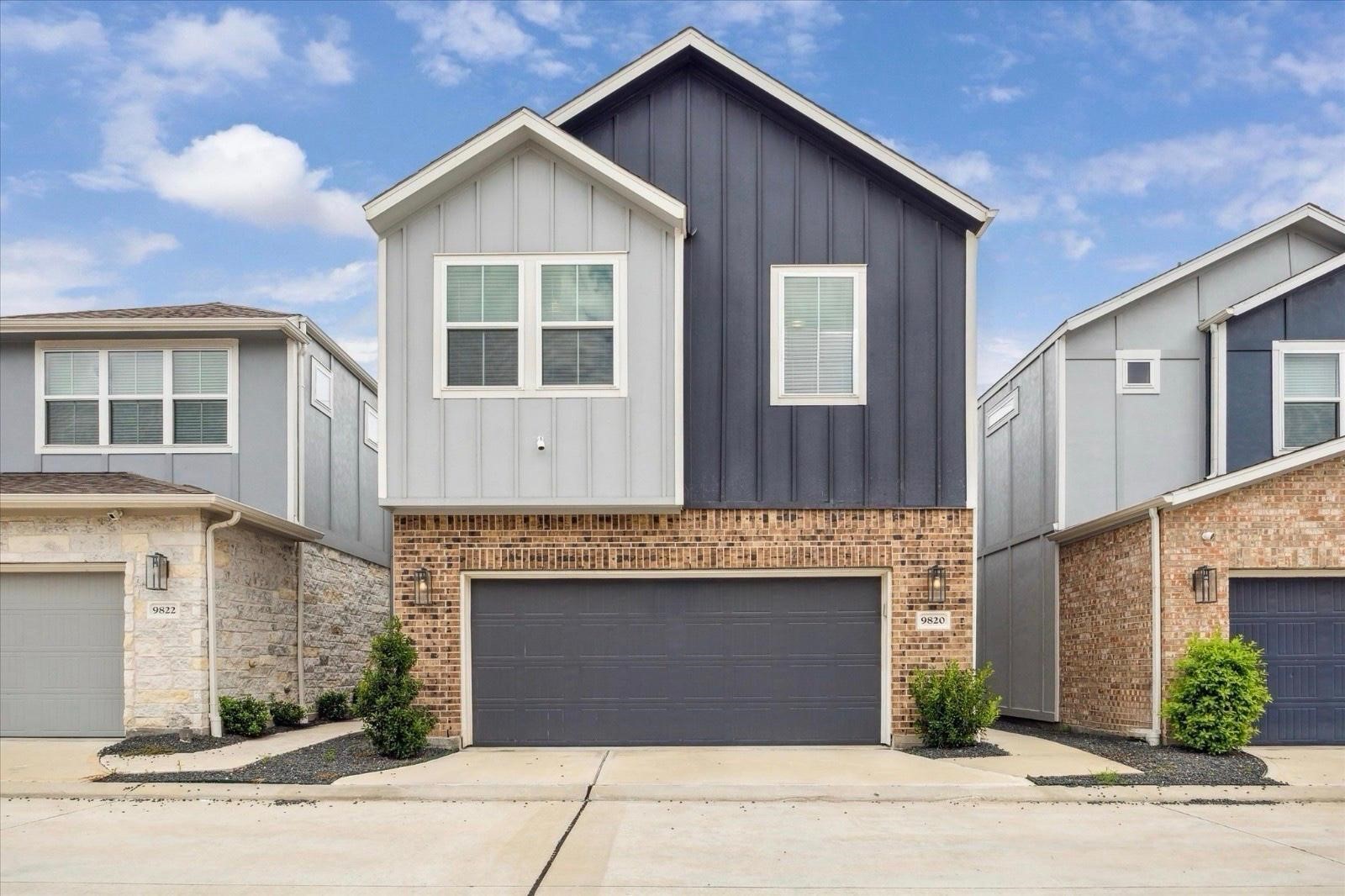 a front view of a house with yard