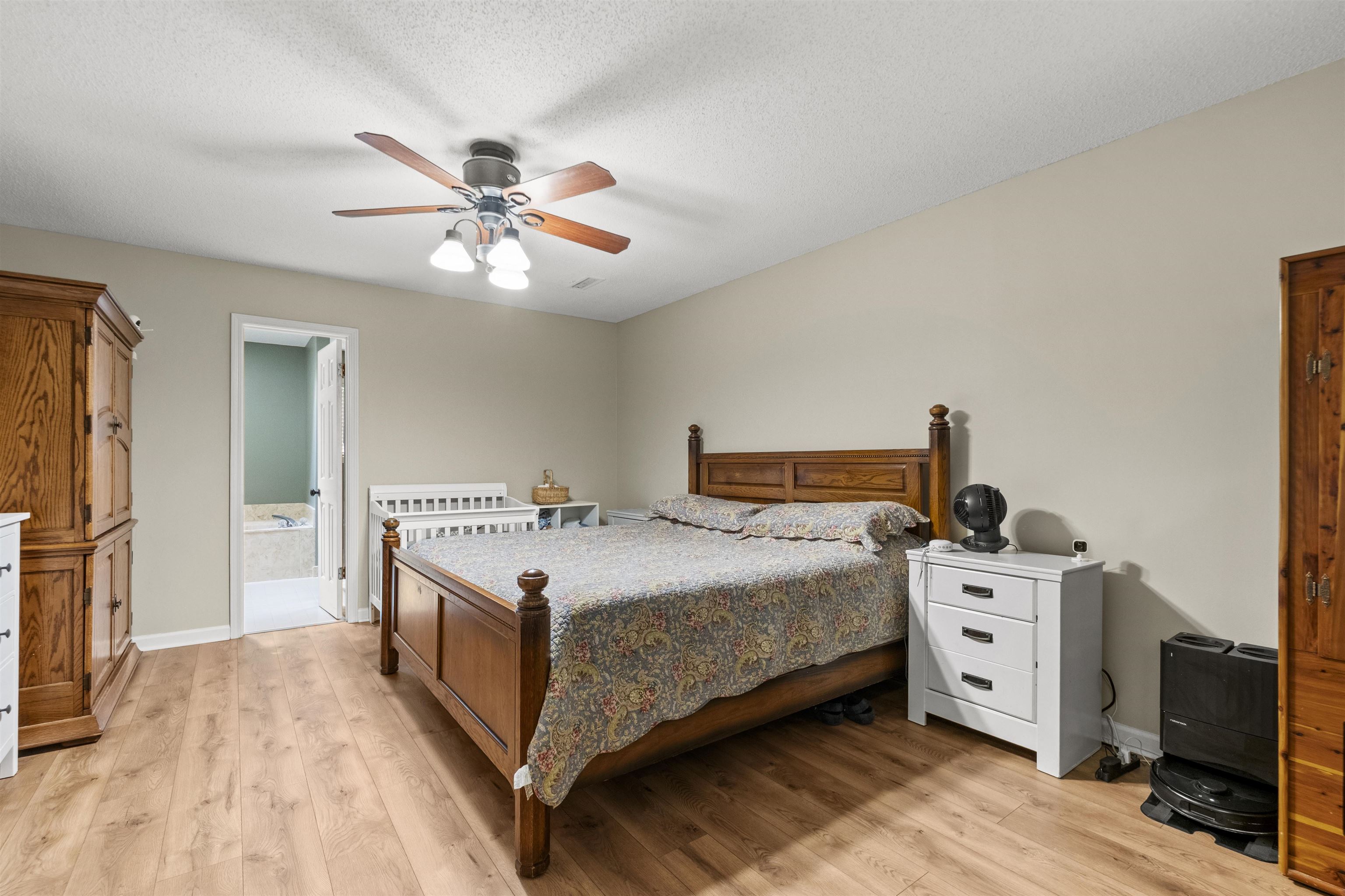 3601 Marshall Road Munford, TN 38058 - Photo 25 of 35 Neutral wall tones complement the wood-finish flooring
