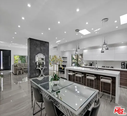 a kitchen with a table and chairs in it