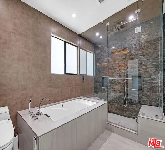 a bathroom with a bathtub and a sink