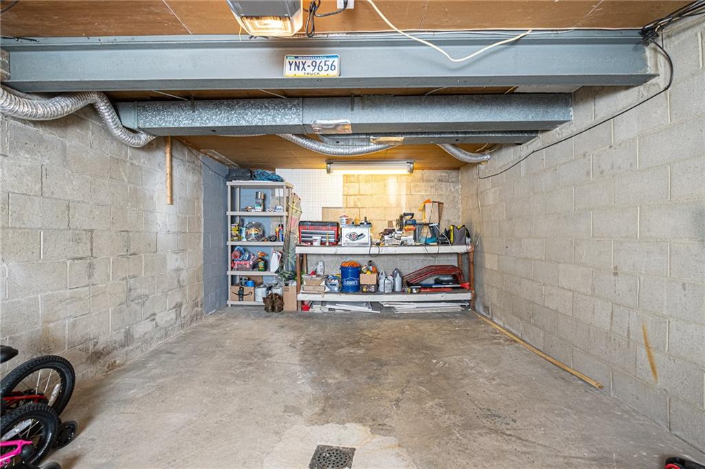 40 Highbury Road Cheswick, PA 15024 - Photo 20 of 25 ONE CAR GARAGE WITH OPENER PLUS THE ADDITIONAL SPACE FOR STORAGE SHELVES.