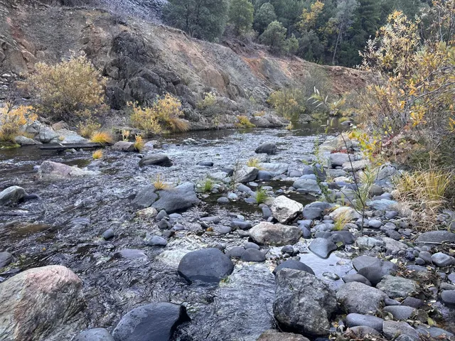 a view of mountain view with large trees