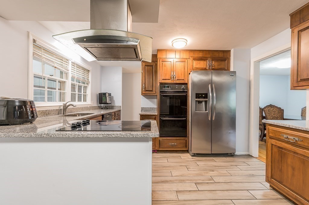 80 Pepper Road Fitchburg, MA 01420 - Photo 15 of 41 a kitchen with stainless steel appliances granite countertop a sink and a refrigerator