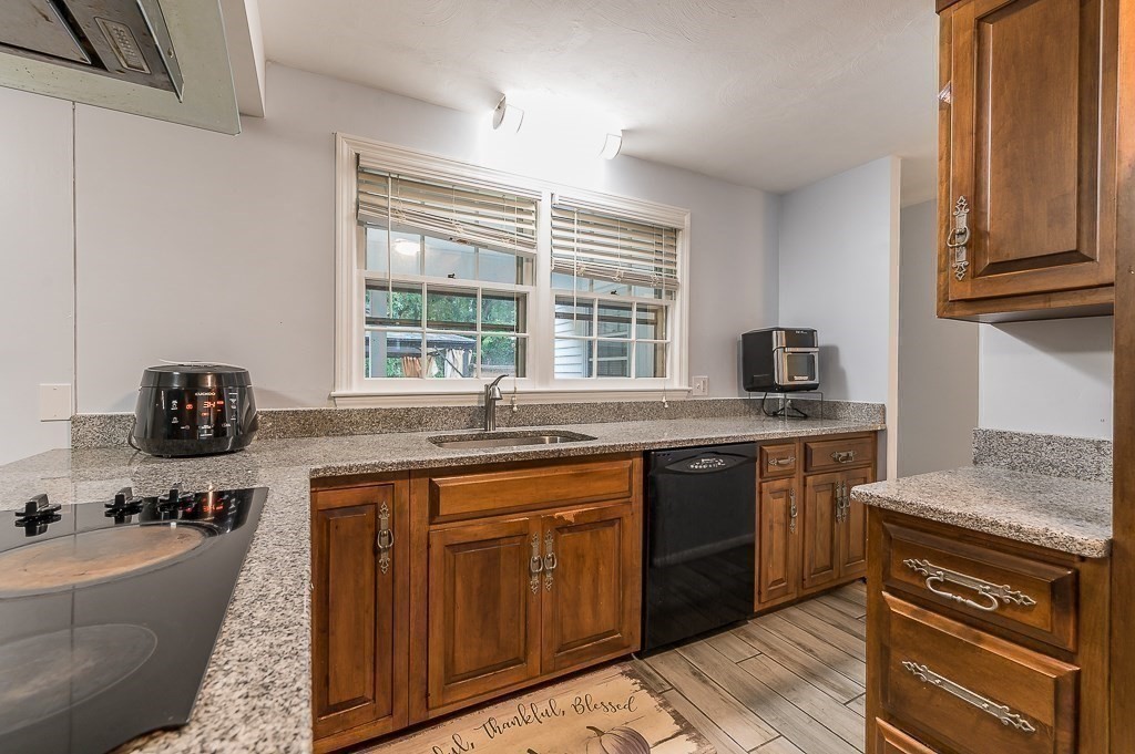 80 Pepper Road Fitchburg, MA 01420 - Photo 16 of 41 a kitchen with granite countertop a sink stove and cabinets