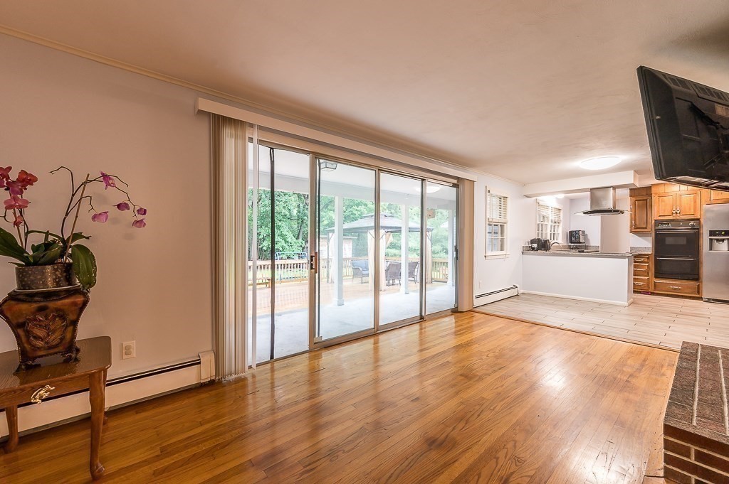 80 Pepper Road Fitchburg, MA 01420 - Photo 18 of 41 a view of a living room hardwood floor and a kitchen