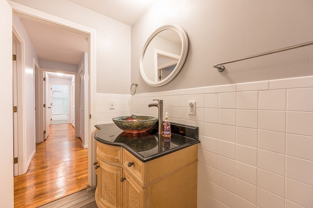 80 Pepper Road Fitchburg, MA 01420 - Photo 22 of 41 a kitchen with a sink and a stove with wooden floor