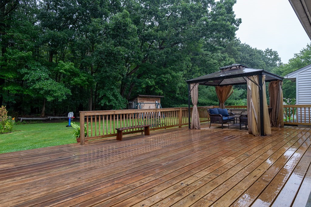 80 Pepper Road Fitchburg, MA 01420 - Photo 41 of 41 a view of a deck with wooden floor and roof with a garden