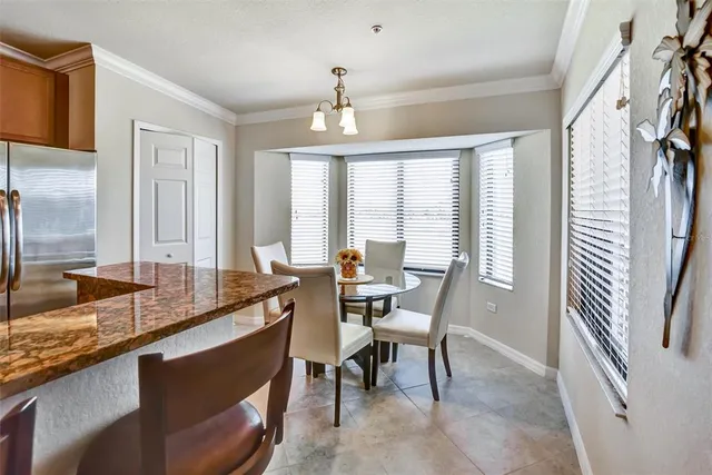 a bedroom with a bed and a flat screen tv on dresser