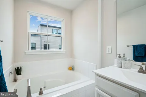 a bathroom with a sink and a bath tub