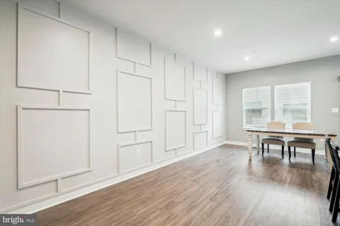a view of a livingroom with furniture wooden floor and window