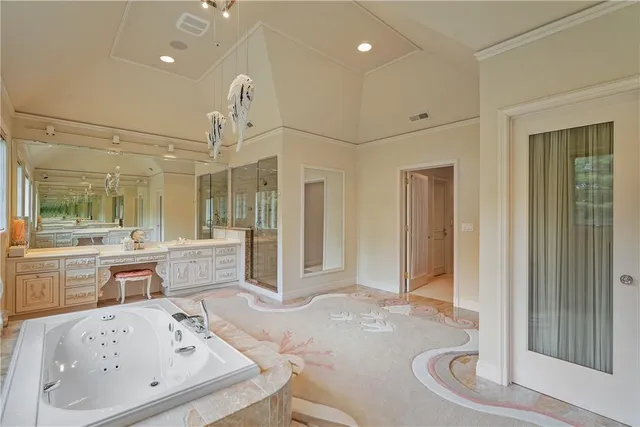 a very nice looking dining room with a large window and chandelier