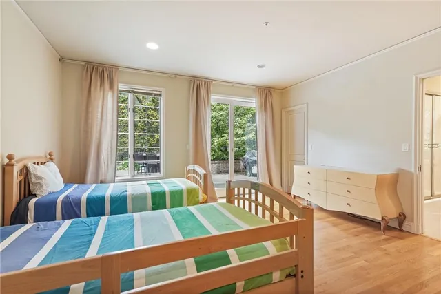 a bedroom with furniture and windows