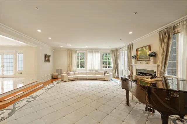 a spacious bedroom with a bed and a large window