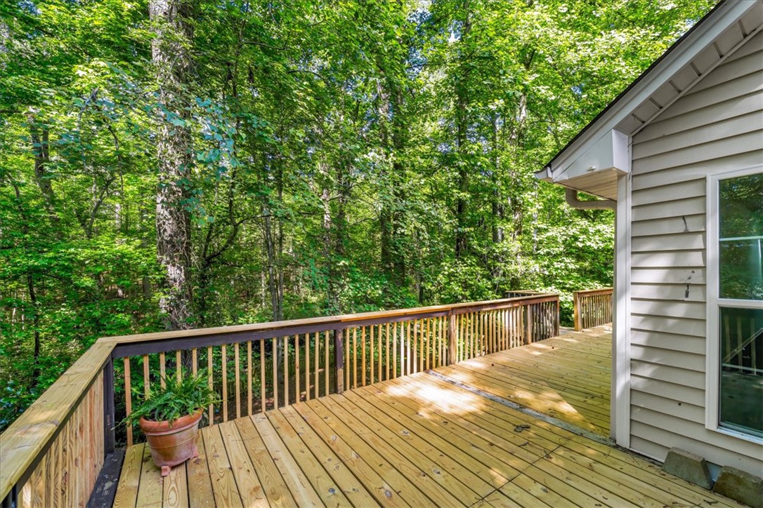 210 Briarcliff Road Central, SC 29630 - Photo 32 of 39 This spacious deck offers a tranquil retreat surrounded by a lush, verdant treeline.