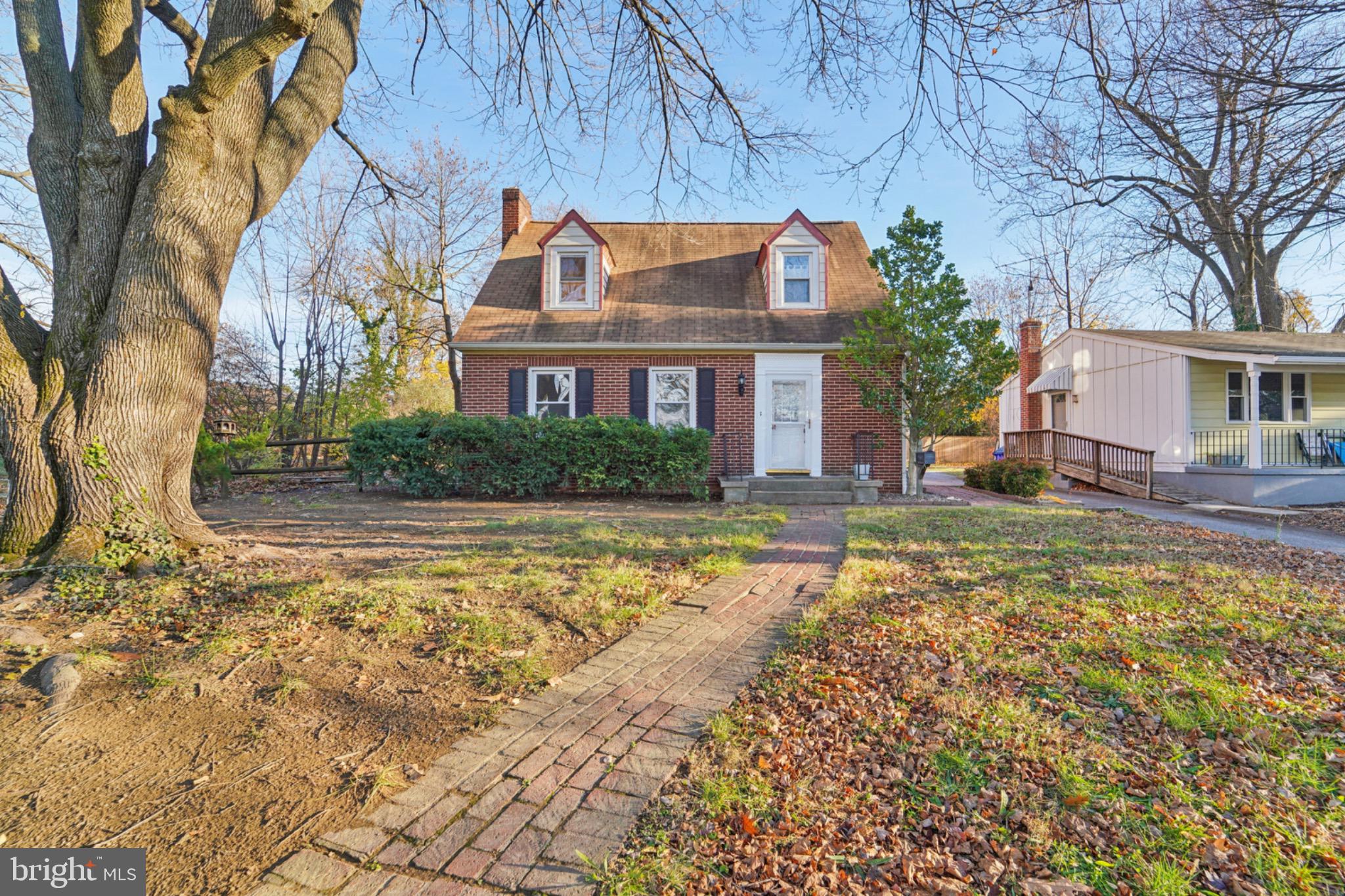 618 Military Road Frederick, MD 21702 - Photo 1 of 37 Charming brick home with inviting pathway.