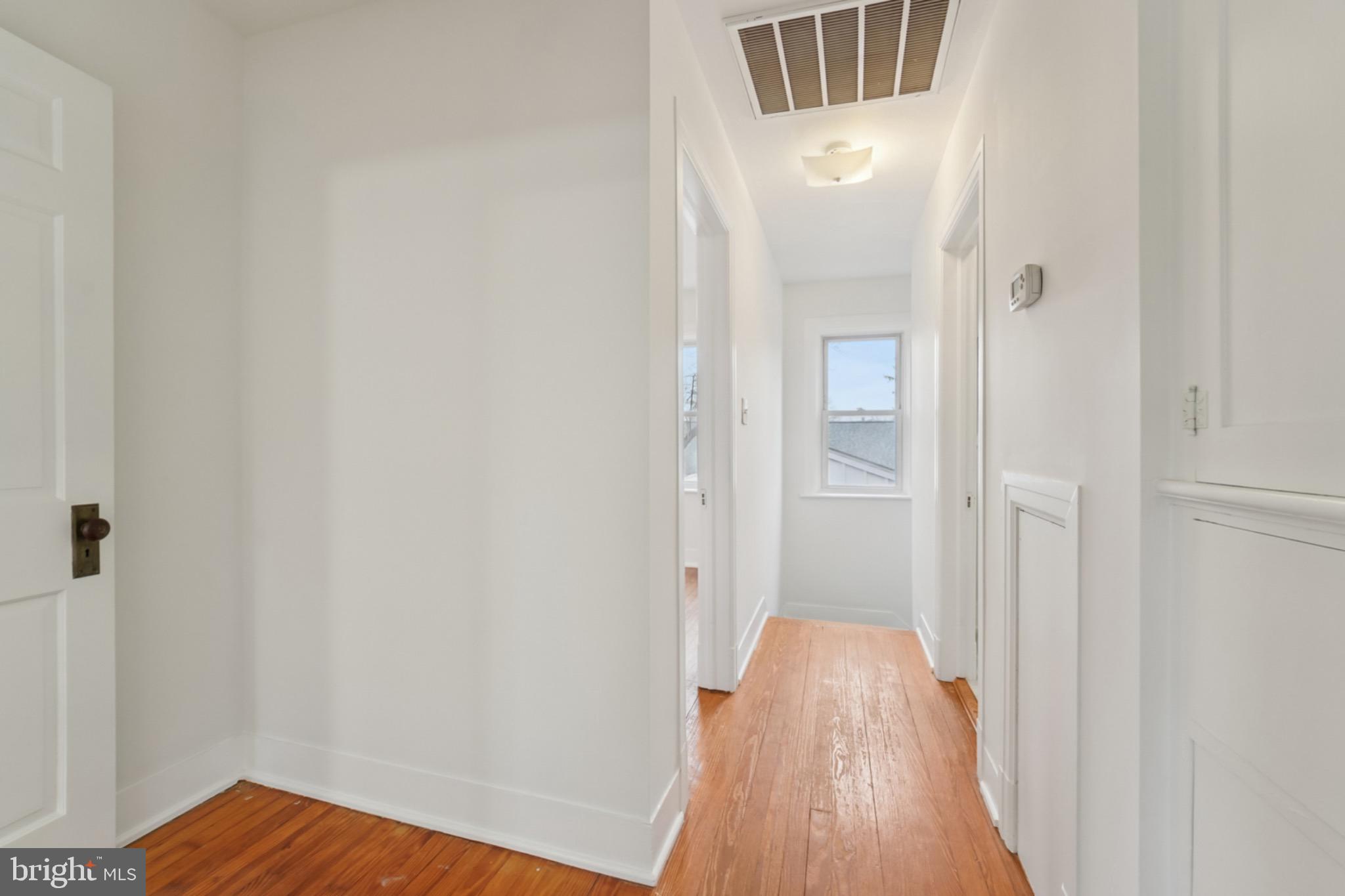 618 Military Road Frederick, MD 21702 - Photo 17 of 37 Bright and inviting hallway with warm tones.
