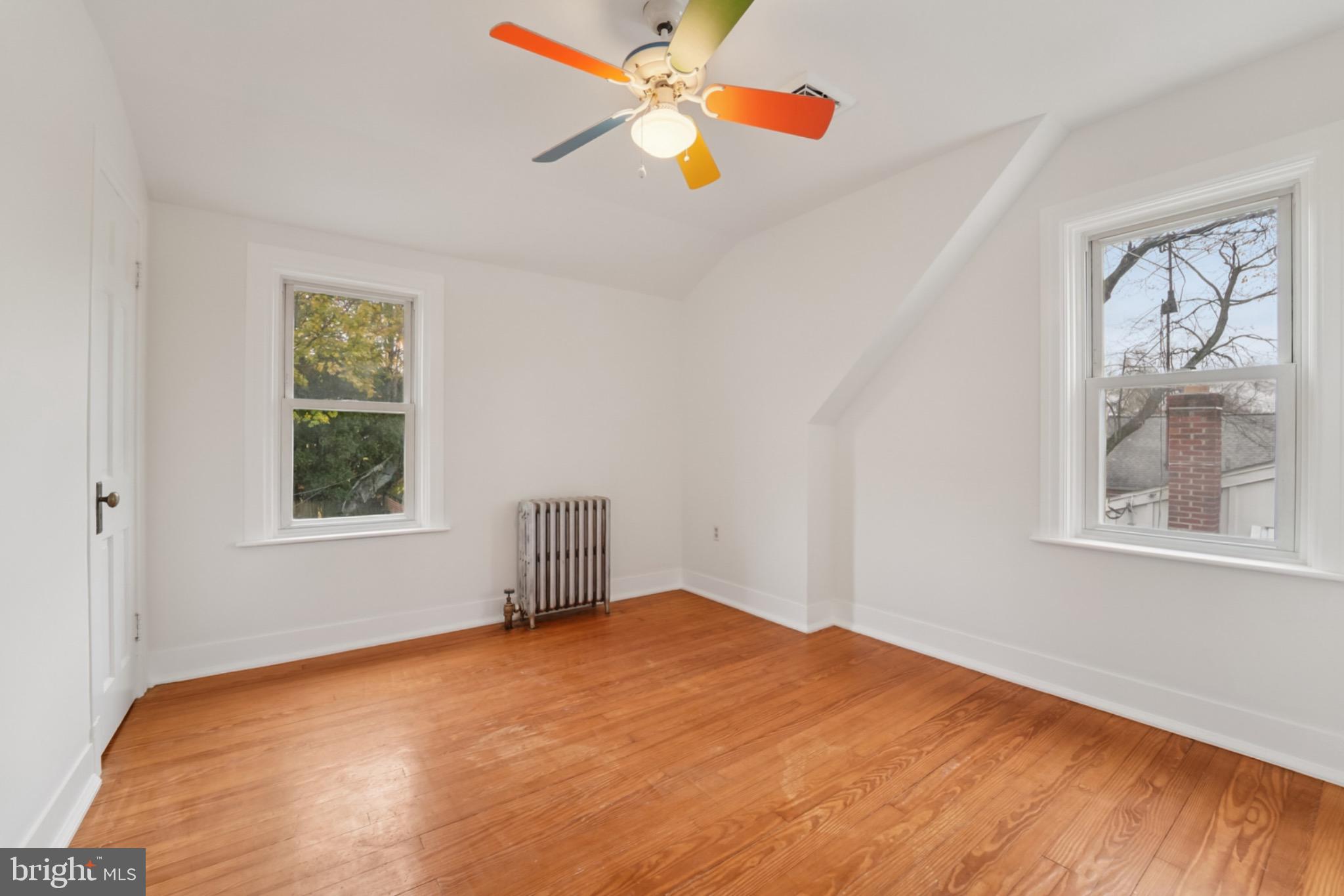 618 Military Road Frederick, MD 21702 - Photo 19 of 37 Bright and airy room with colorful ceiling fan.
