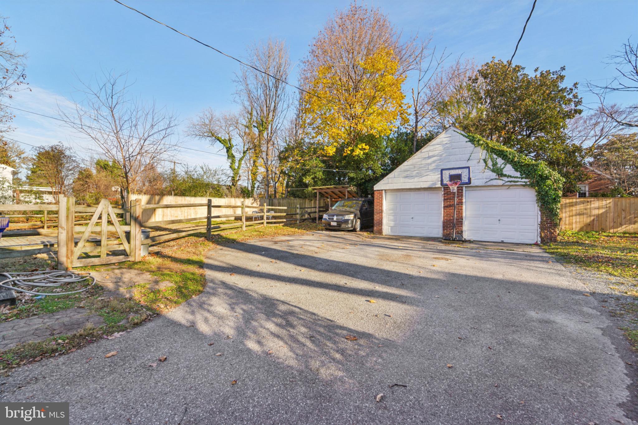 618 Military Road Frederick, MD 21702 - Photo 5 of 37 Spacious driveway with a charming garage.