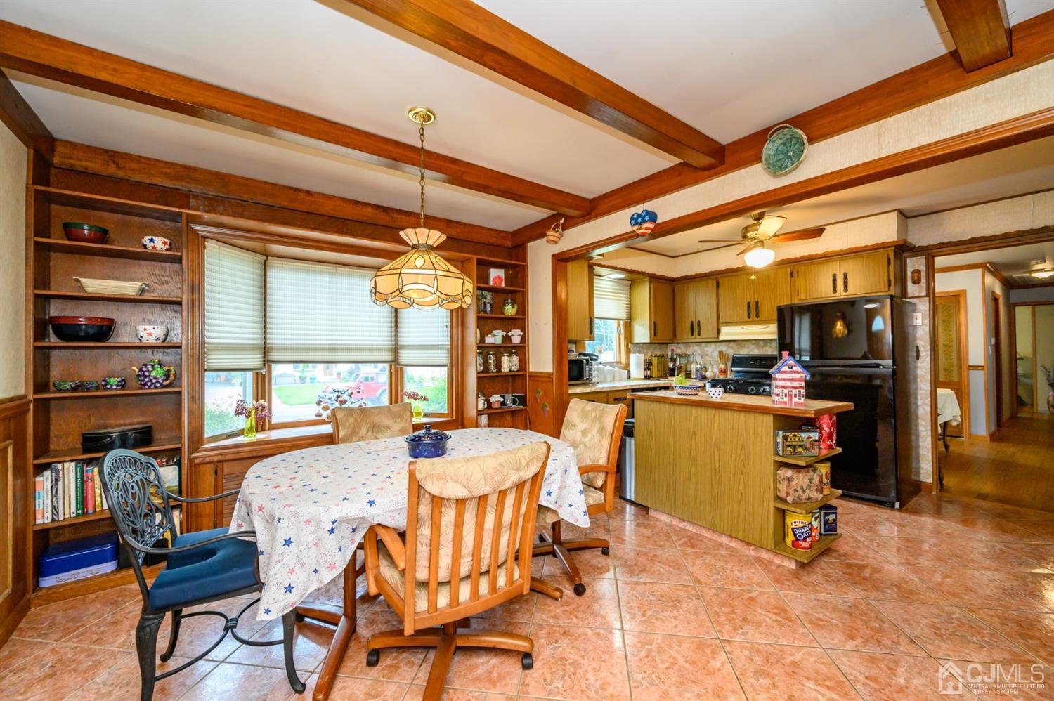 9 Brandeis Road Old Bridge, NJ 08859 - Photo 14 of 45 a dining room with furniture and a large window