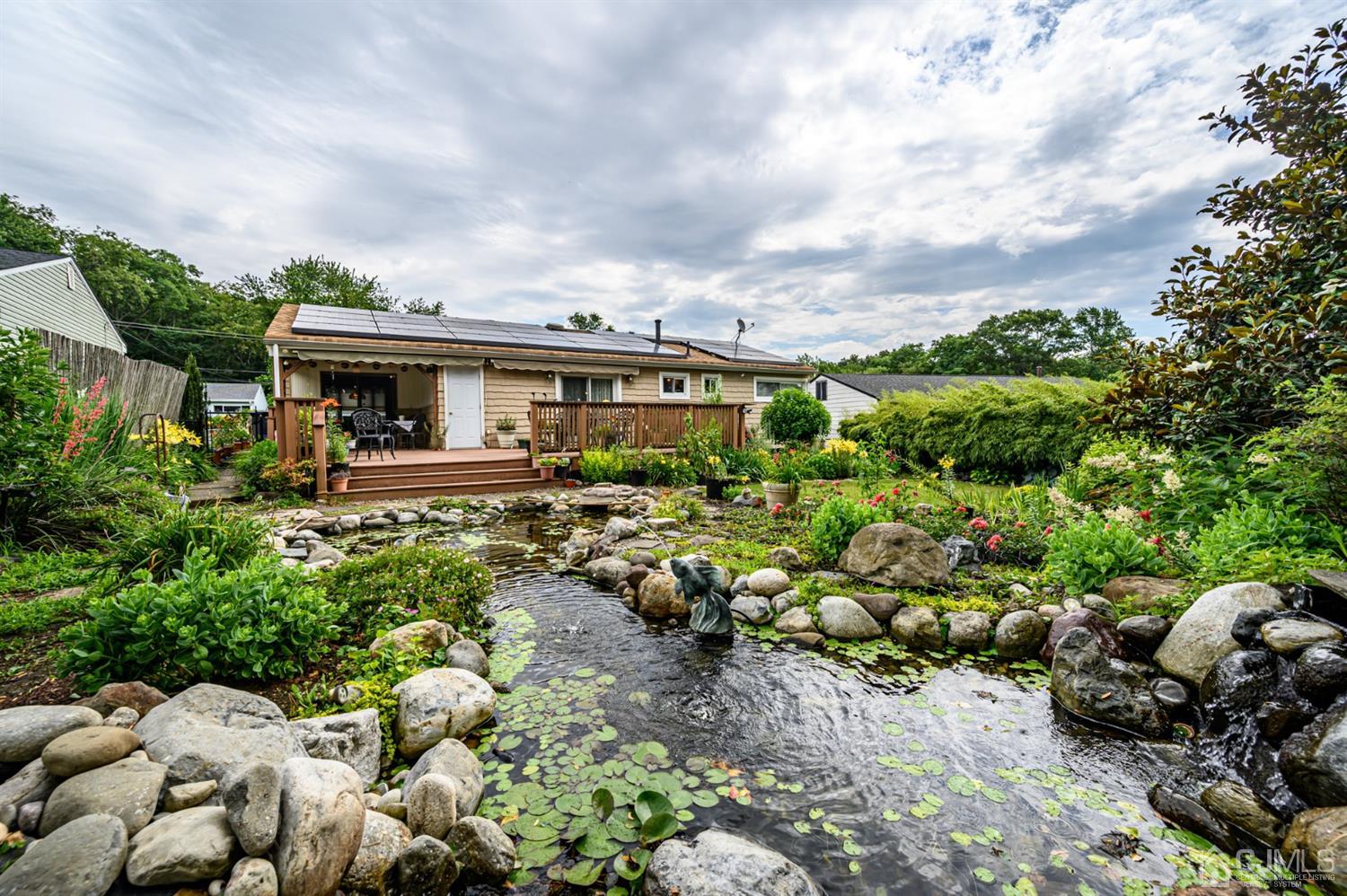 9 Brandeis Road Old Bridge, NJ 08859 - Photo 40 of 45 a picture of a house with a garden
