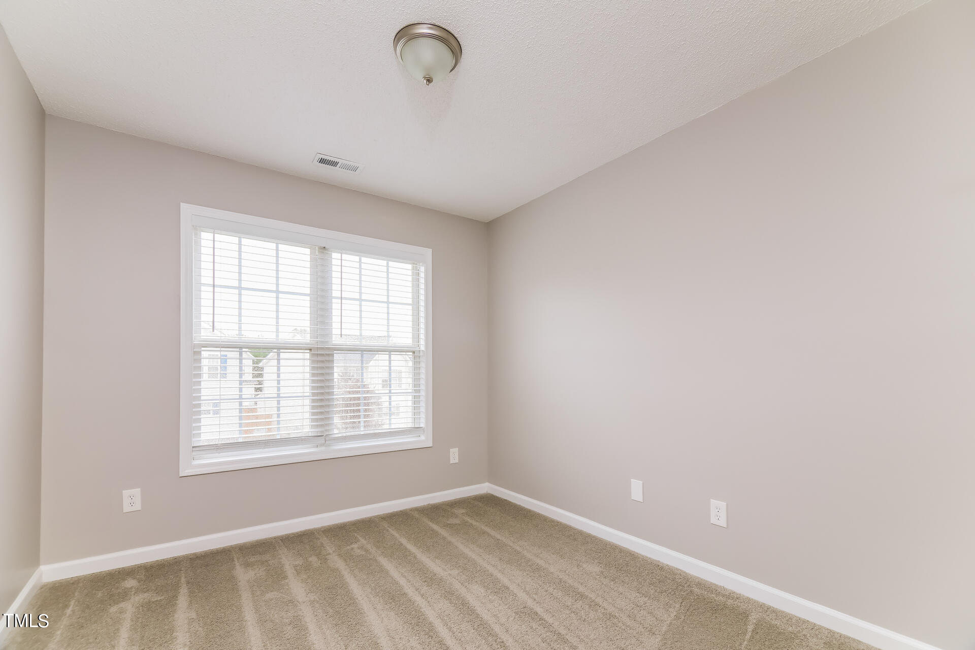 4404 Windsock Lane Raleigh, NC 27616 - Photo 11 of 15 a view of an empty room with a window