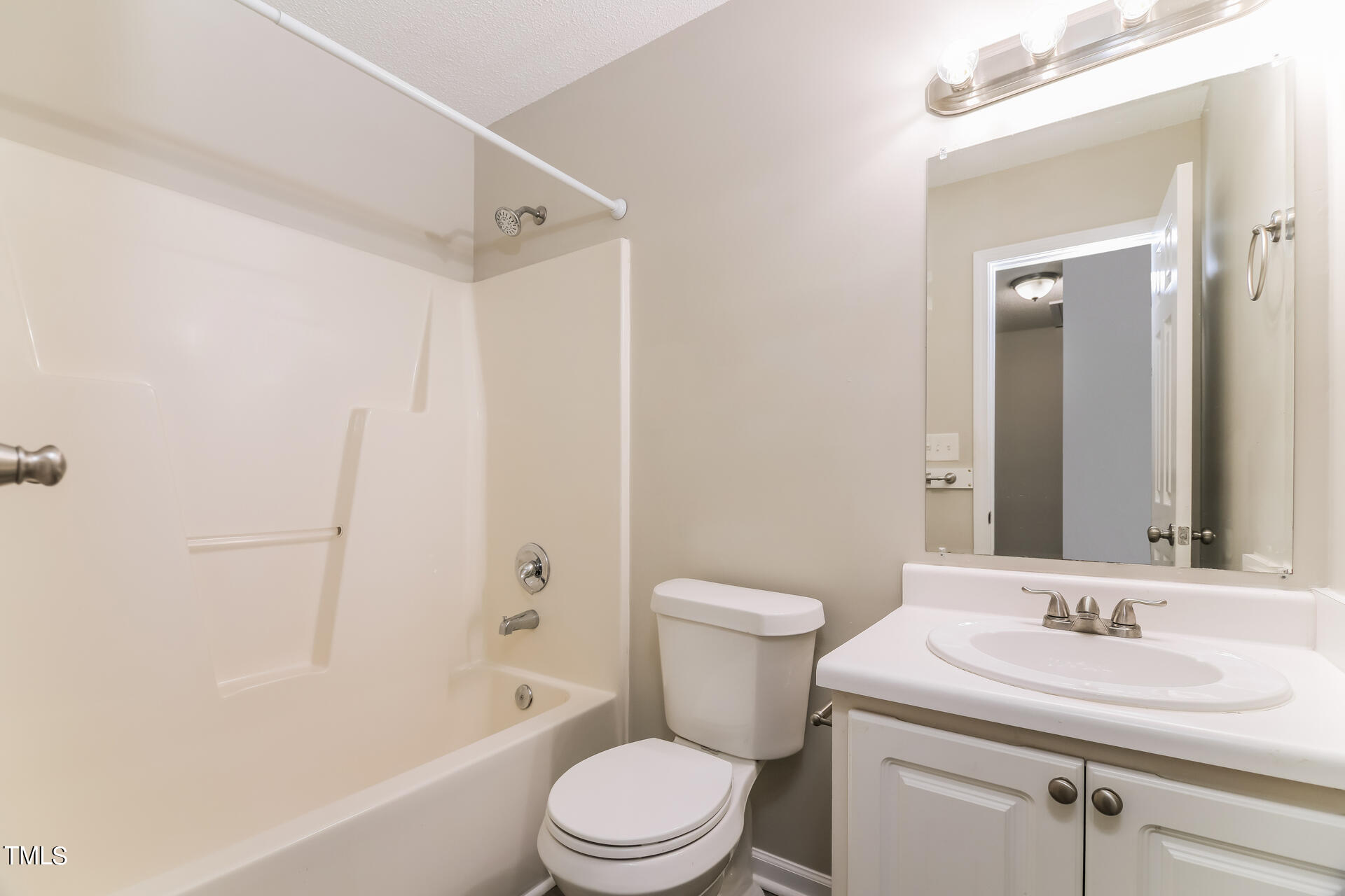 4404 Windsock Lane Raleigh, NC 27616 - Photo 12 of 15 a bathroom with a sink toilet vanity and shower