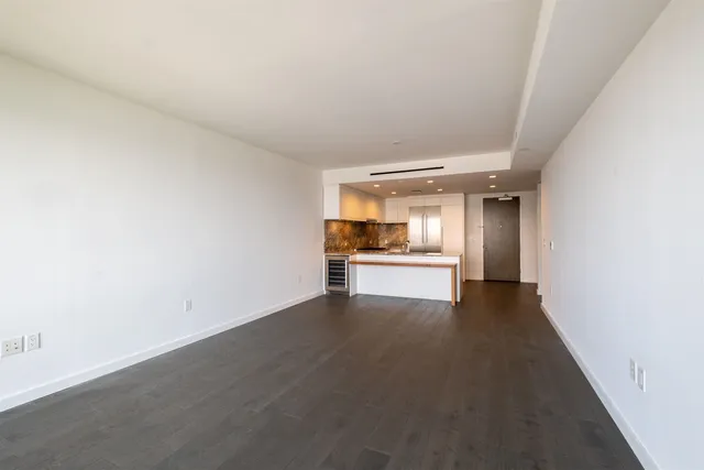 a view of a kitchen with a sink dishwasher stove and refrigerator