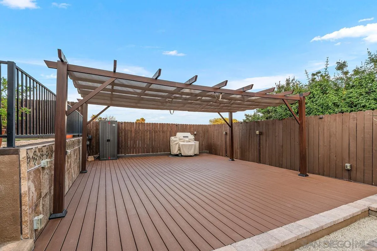 9469 Pike Road Santee, CA 92071 - Photo 21 of 39 a view of a wooden deck with a backyard